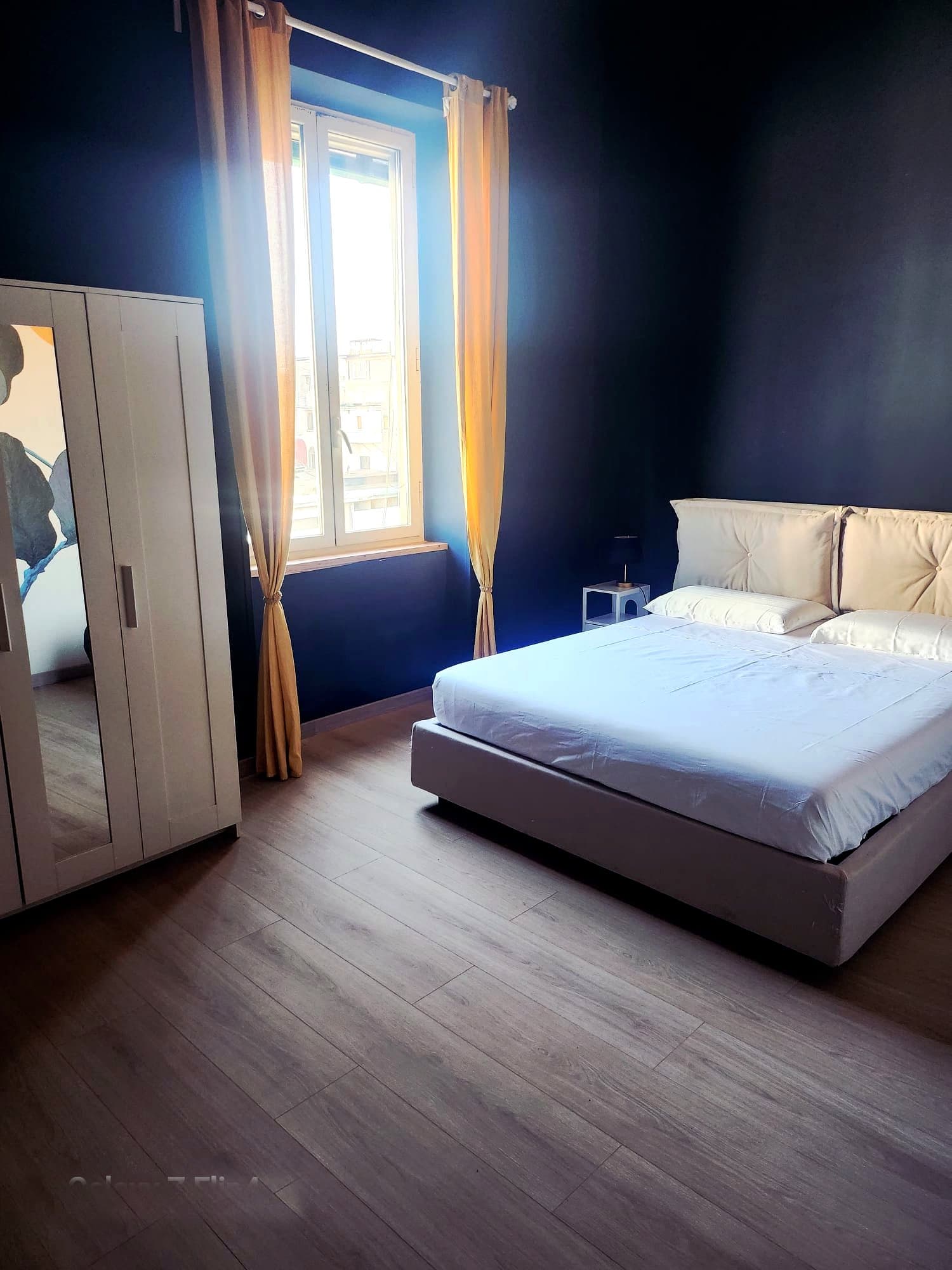 Camera da letto con vista sui tetti di Portici